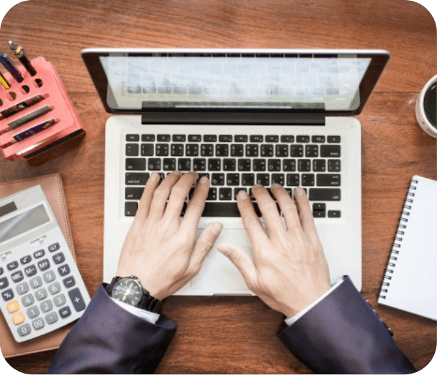 calculator and white laptop on table